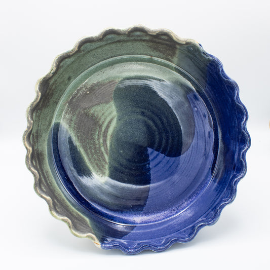 Durable stoneware pie plates that go from your oven to the table. Can be used for a variety of hot and cold dishes.

Approximately 10" Diameter x 2" Deep.